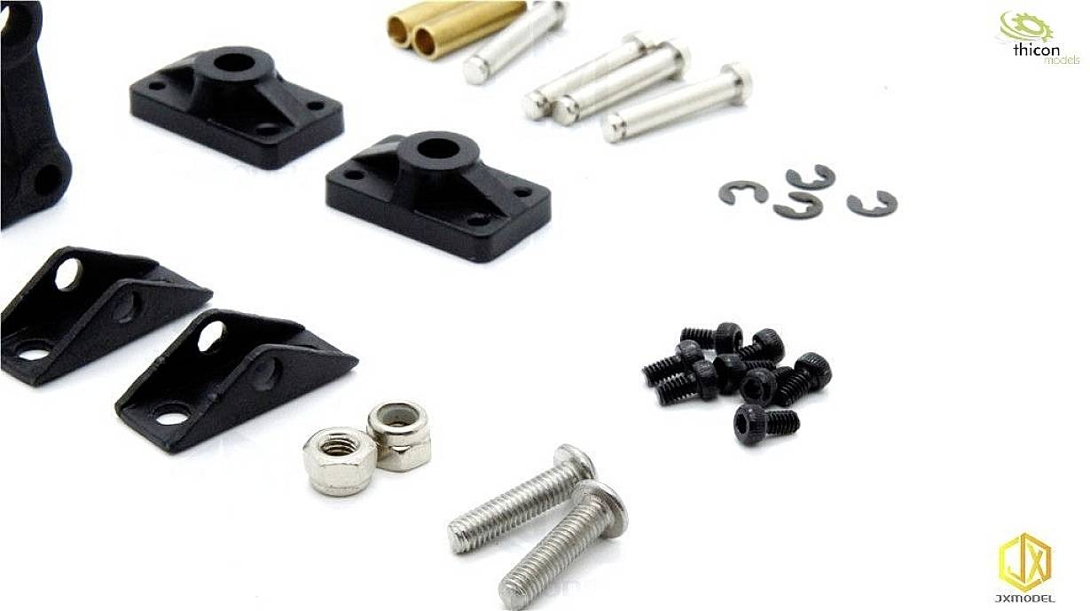'Various small metal and plastic parts, including screws, nuts, and angle brackets, on a white surface.'