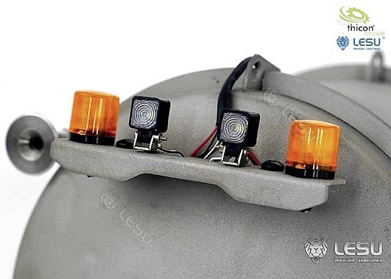 Grey electronic component with two orange lights and three small square illuminations, brand logos positioned top and bottom right.