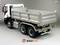 A model of a white tipper truck on a grey background. Distinct details visible on the loading area and wheels.