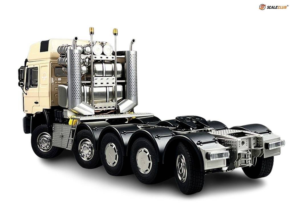 A model lorry in beige and silver with four axles, without a trailer, on a white background.