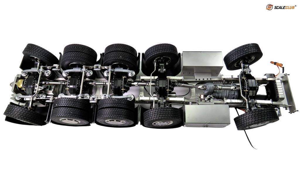 View from below of a lorry model with eight wheels. Axles, suspension, and drivetrain are clearly visible.