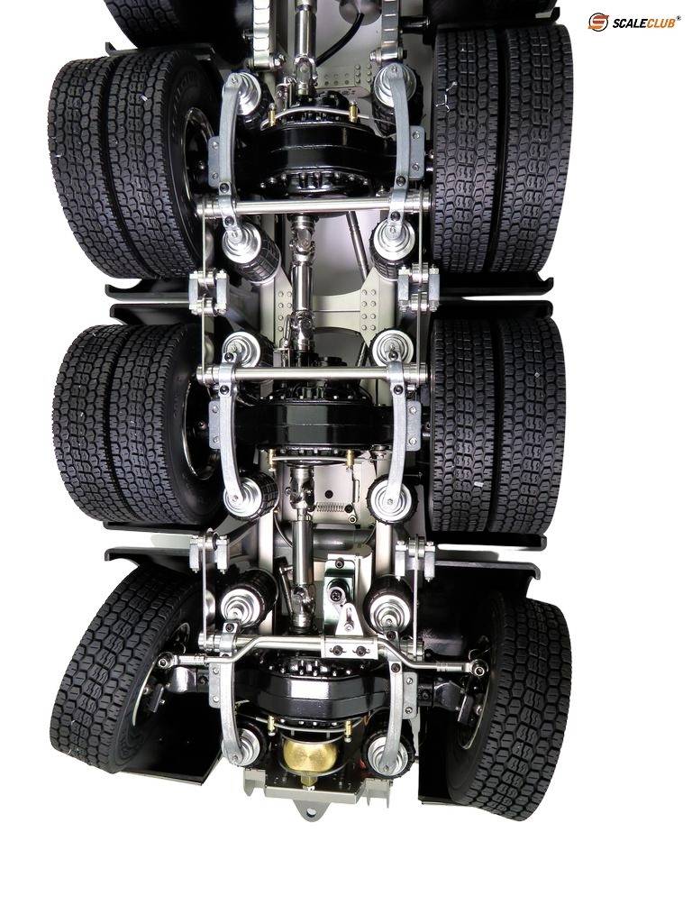 'Detailed view of a lorry chassis with tyres and suspension system.'