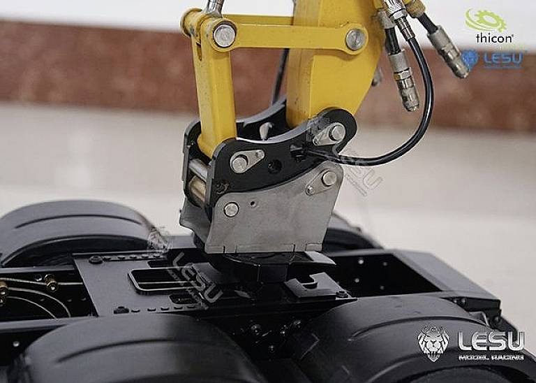 A yellow hydraulic grab arm mounted on a black metal base, surrounded by technical details and company logos.