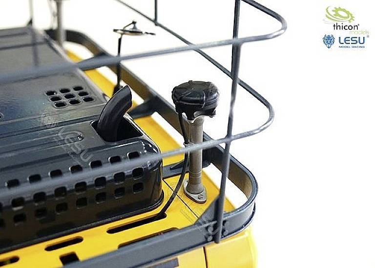 A model vehicle detail shows the roof of a yellow vehicle with a protective grille, a removable cover, and an antenna.