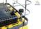 A model vehicle detail shows the roof of a yellow vehicle with a protective grille, a removable cover, and an antenna.