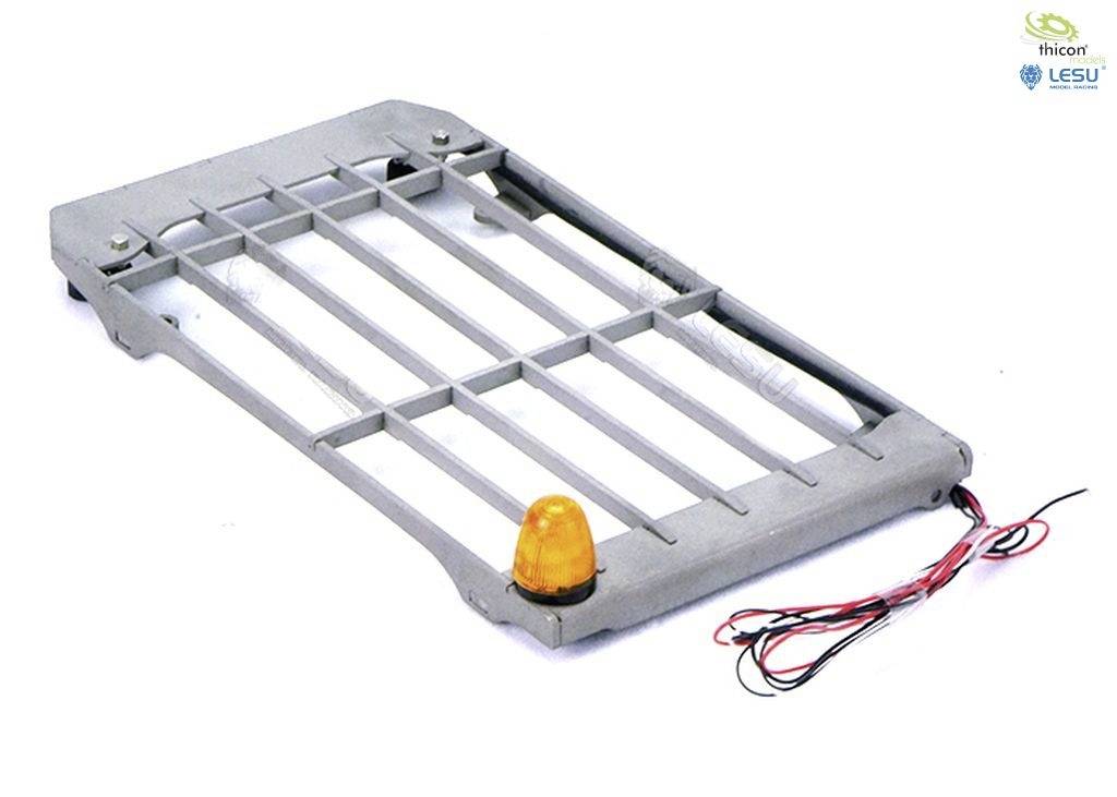 A grey, rectangular metal beam with an orange warning light fixed to the edge, and connected cables.