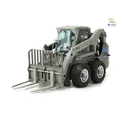 A grey compact loader with fork attachment, suitable for construction or agricultural uses. Brand logos visible in the top right corner.