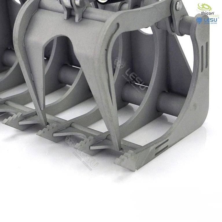 Metallic, grey-painted gripping mechanism with multiple pincers. Two company logos are located in the top right-hand corner.