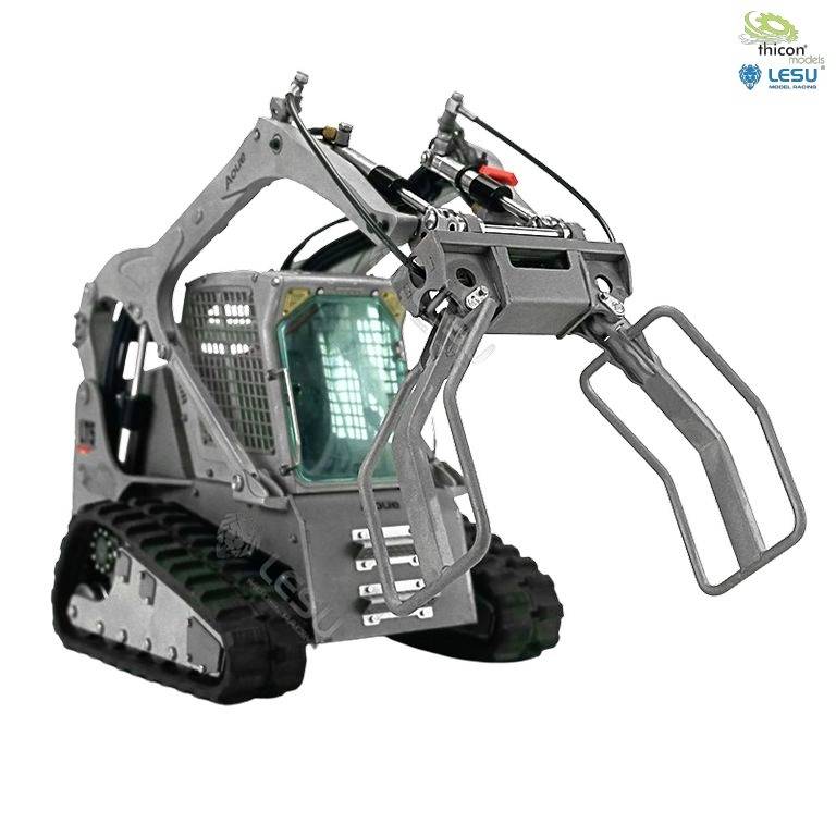 A small grey excavator with tracked drive and open grab bucket, ideal for confined construction site work.