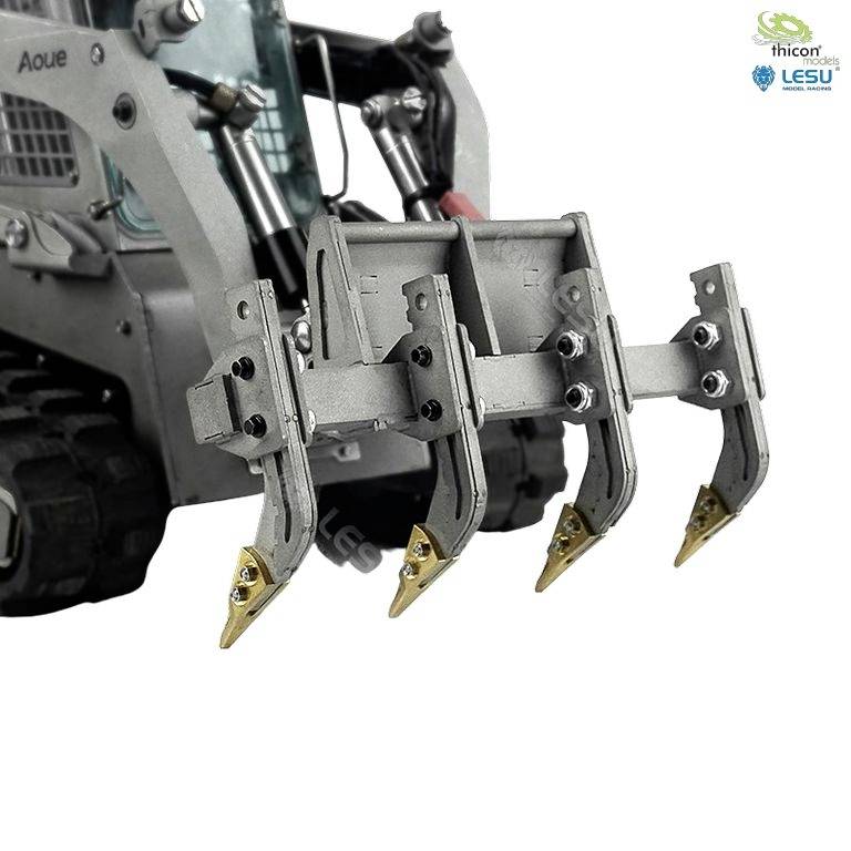 A small excavator with a grab attachment is visible in a bright studio setting. The bucket and hydraulic details are clearly identifiable.