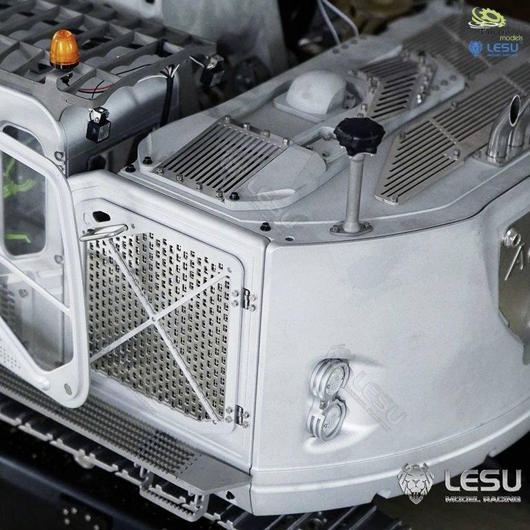 A detailed model vehicle in grey, possibly a construction or agricultural machine, with technical elements and brand logos.