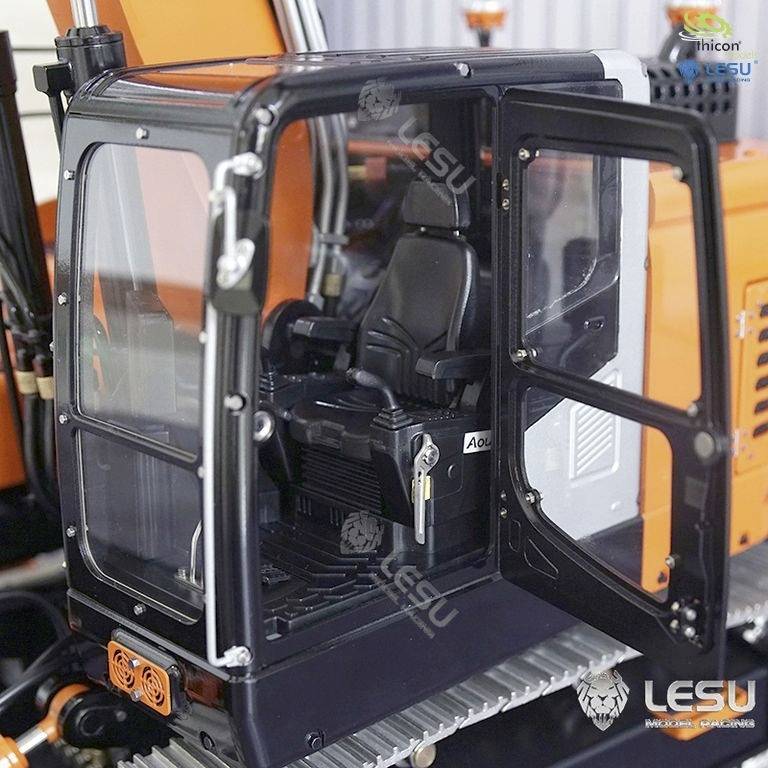 An orange mini-excavator with an open driver's cab. The seat and controls are visible, with no person present.