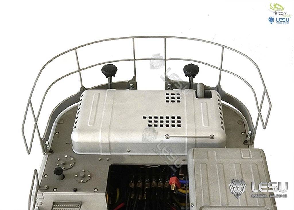 Metal structure with handrail and electronic components in a technical device.