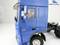 A blue model lorry with a detailed view of the driver's cab. A figure is seated at the wheel. Text: 'WEDICO-models'.