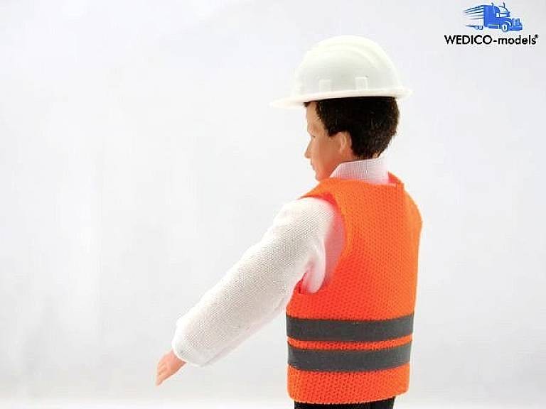 Toy figurine in a work vest and hard hat, viewed from the side.
