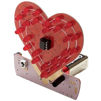 Heart-shaped LED circuit with red LEDs forming a heart pattern, mounted on a circuit board, with a battery holder beside it.