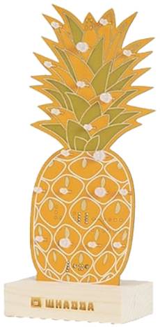 A decorative pineapple made of wood with an orange casing and green leaves, mounted on a base with the inscription 'ШНАДА'.