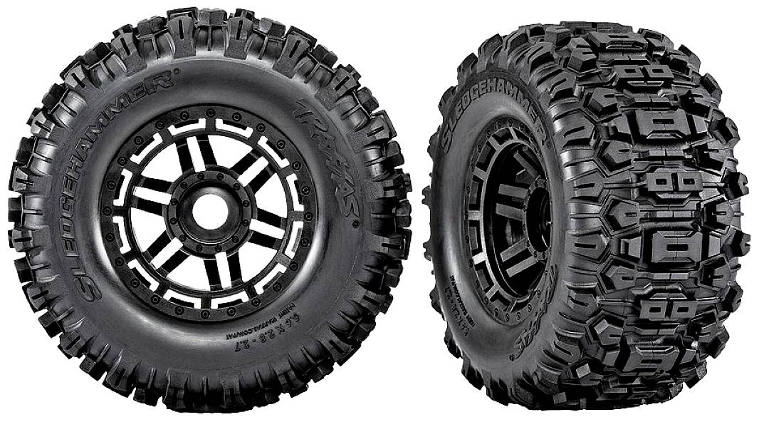 Two black off-road tyres with a rugged tread pattern. The tyre on the left viewed from the side, the tyre on the right viewed from the front.