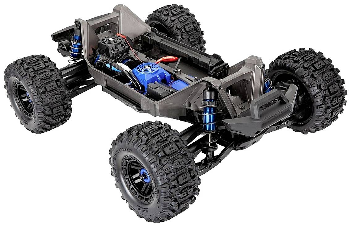 Remote-controlled car chassis without bodywork, large off-road tyres, visible electronic components and shock-absorbing suspension.