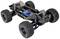 Remote-controlled car chassis without bodywork, large off-road tyres, visible electronic components and shock-absorbing suspension.