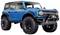 Blue off-road vehicle with large tyres and robust design, suitable for off-road driving.