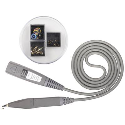 A grey cable with a plug and metal tips. In the background, there are three small boxes with coloured rings and small metal parts.