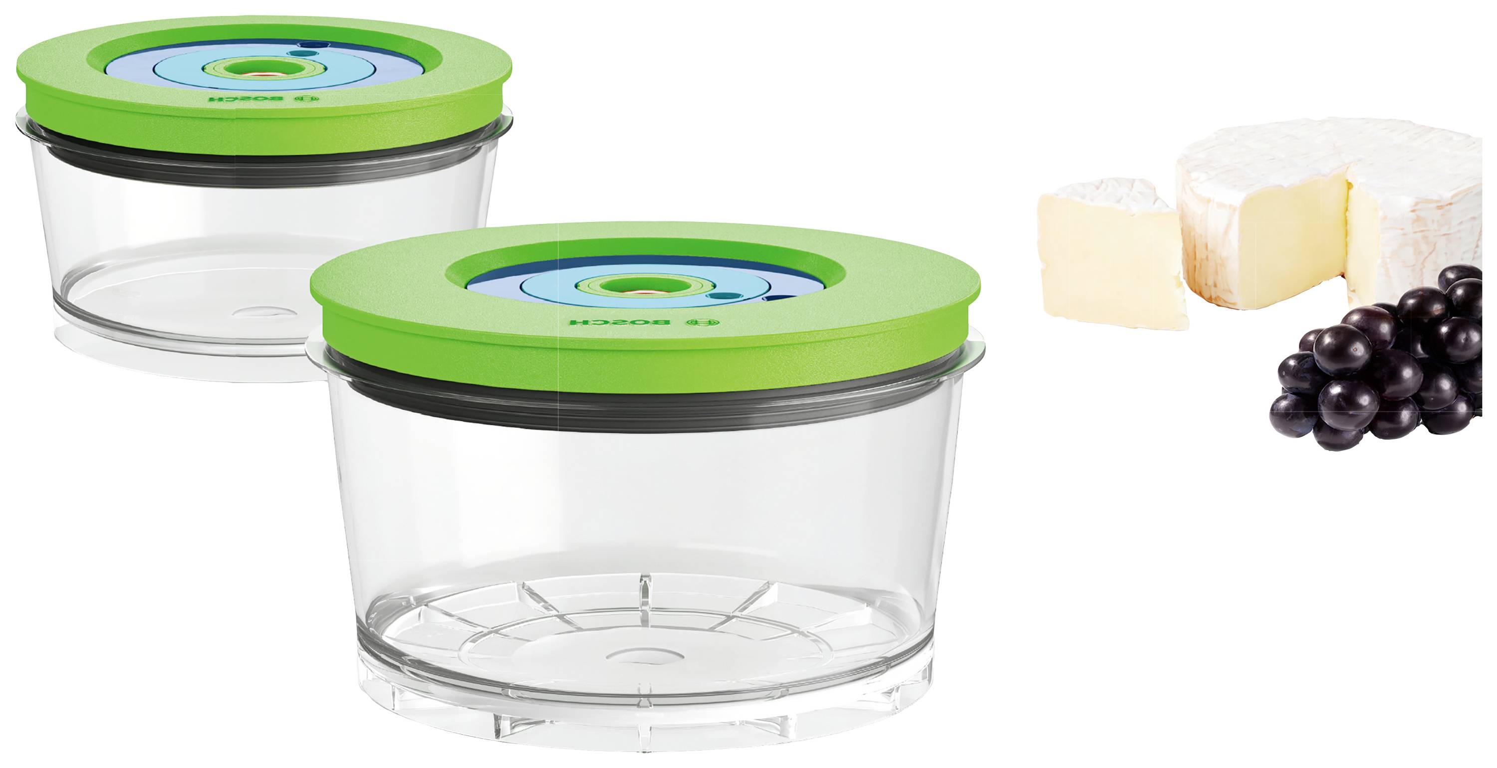 Two round, transparent containers with green lids, next to some cheese and grapes. Suitable for food storage.