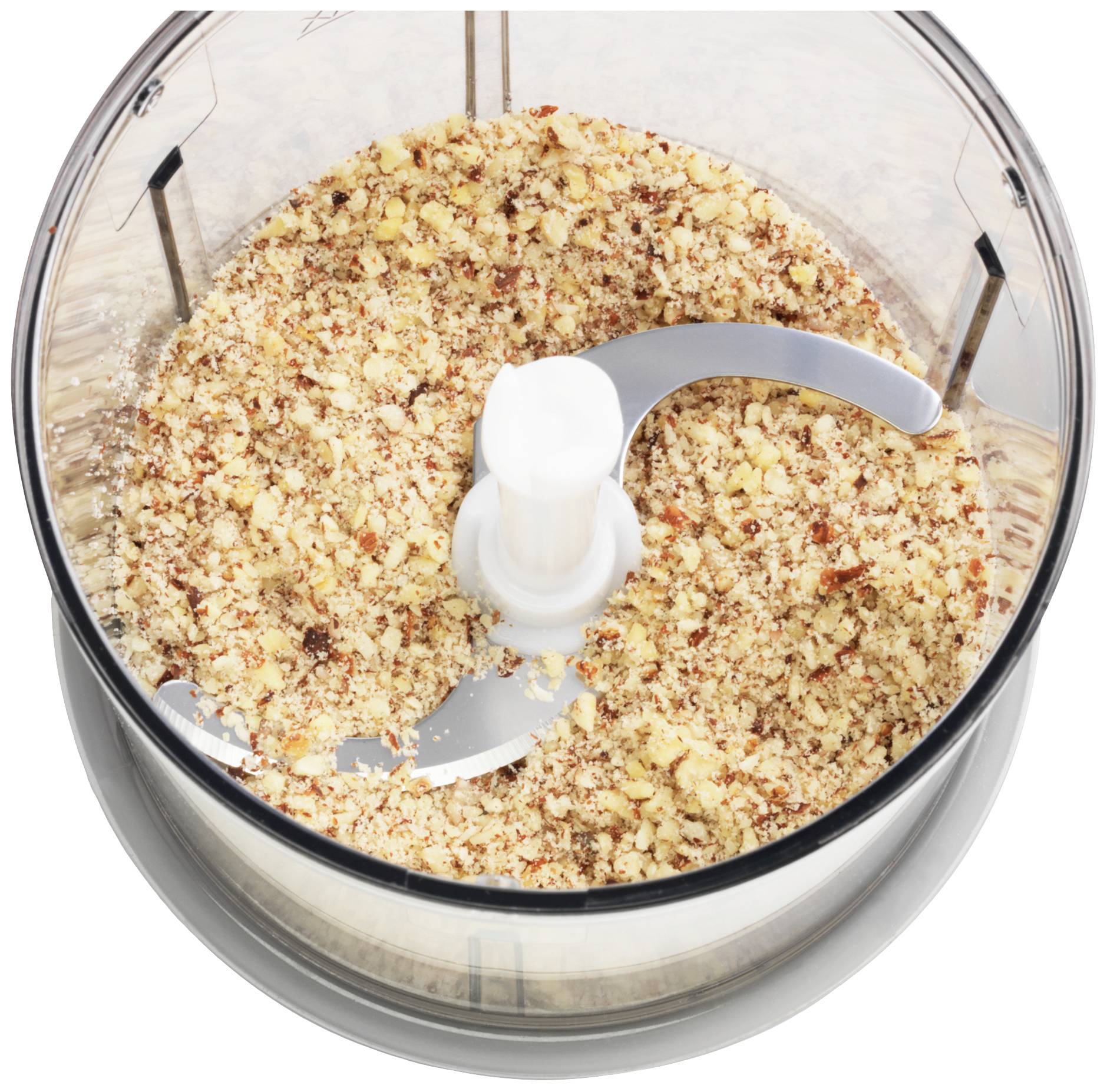 Chopped nuts in a food processor, ready for use in recipes.<br><br>Note: This translation is already very close to British English. The key changes would be using "food processor" instead of "Küchenmaschine", which is standard terminology in British English.