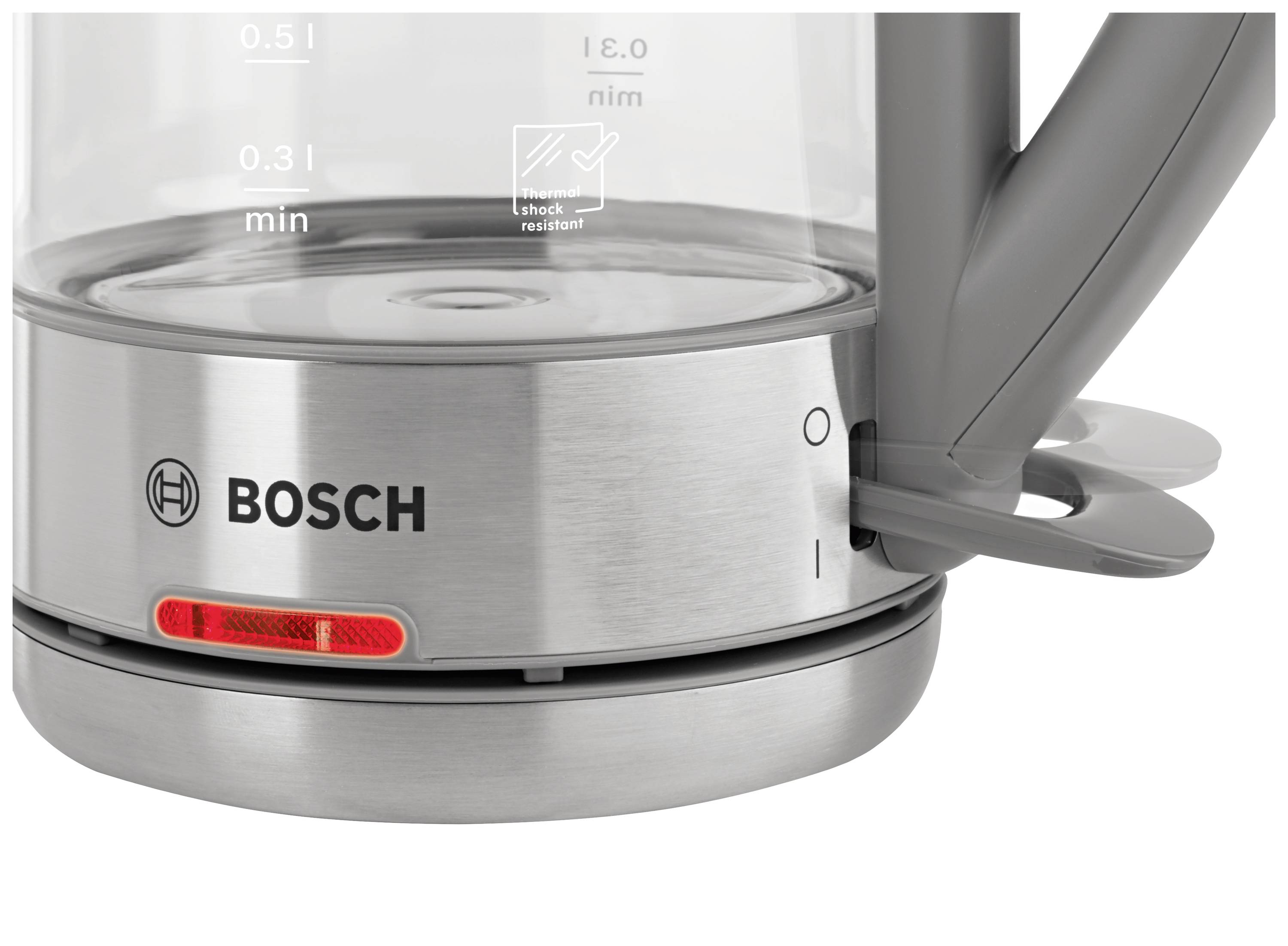 A glass and stainless steel electric kettle with an illuminated on/off switch and a visible water level indicator.