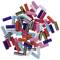 Colourful, multicoloured plastic tubes of varying lengths scattered on a white background.