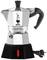 A Bialetti Elettrika espresso machine in silver with a black handle and cable. Design featuring brand logo and red indicator light.