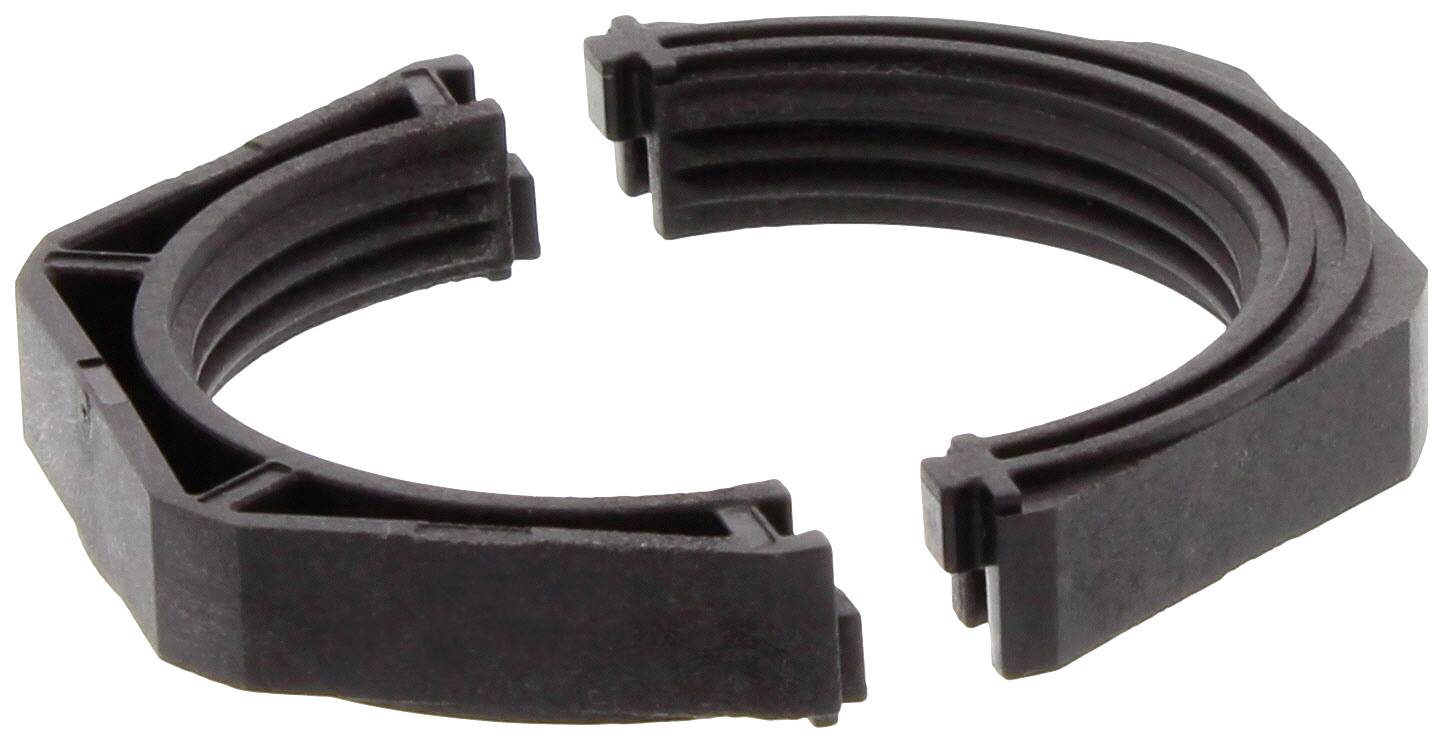 A broken, black plastic ring with jagged edges.