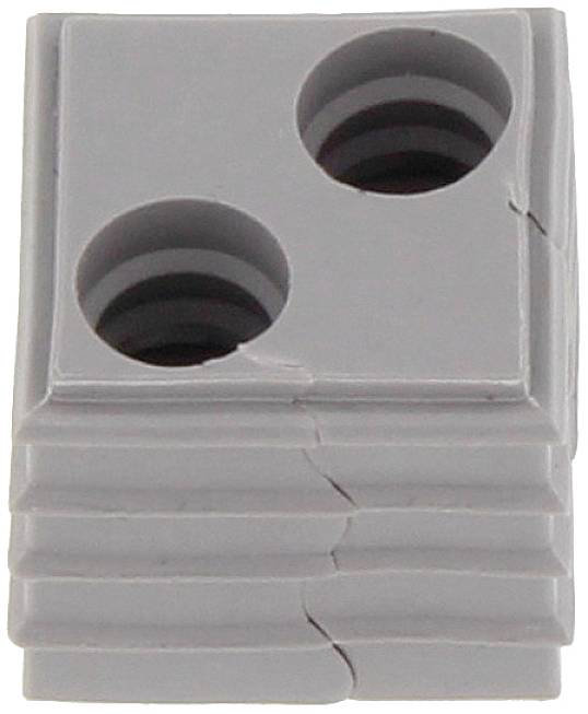A grey, rectangular plastic block with two round holes at the top; the surface shows several cracks and fractures.