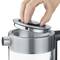 A hand lifts the lid of a silver kettle. The kettle has a modern stainless steel design.