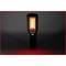 A portable work light that radiates red light stands upright in the middle of a dark background.