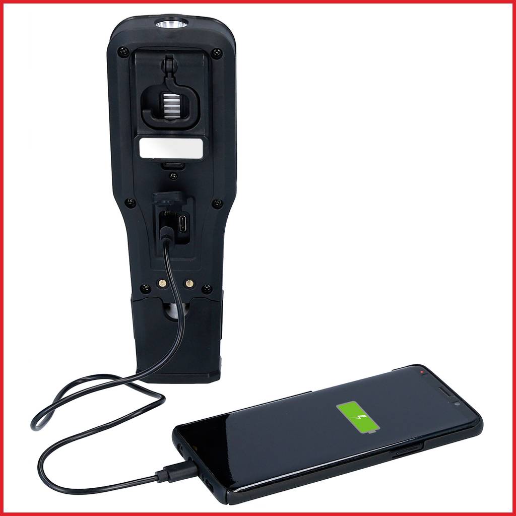 A handheld device is connected to a smartphone and charging it. The smartphone displays a fully charged battery symbol.