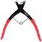 A red and black spring clip pliers used for loosening and securing clips on hoses in vehicle engine compartments.