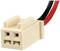 A two-pole white connector plug with red and black wires.
