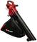 A red and black leaf blower by Einhell with a large collection bag and an ergonomic handle, standing on a small wheel.