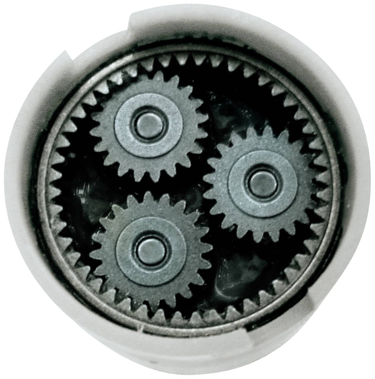 Three small gears are symmetrically arranged within a larger gear, forming a planetary gear system.