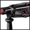 A hammer drill with a black handle, mode selector switch, and depth stop.