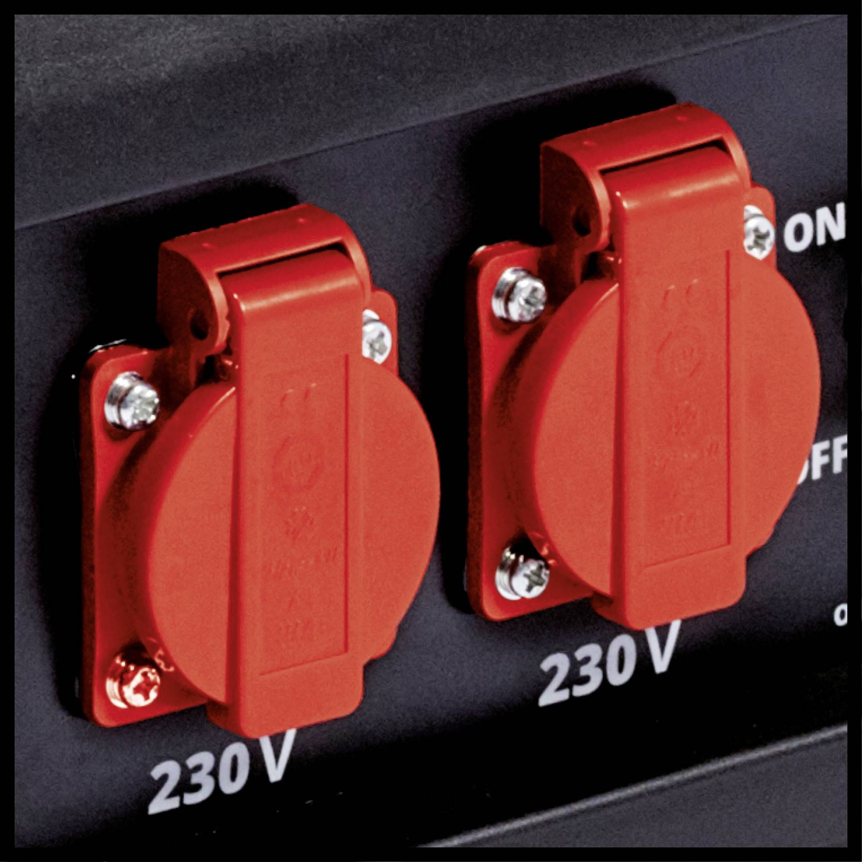 Two red electrical sockets with protective covers on a black background, marked with '230 V'.