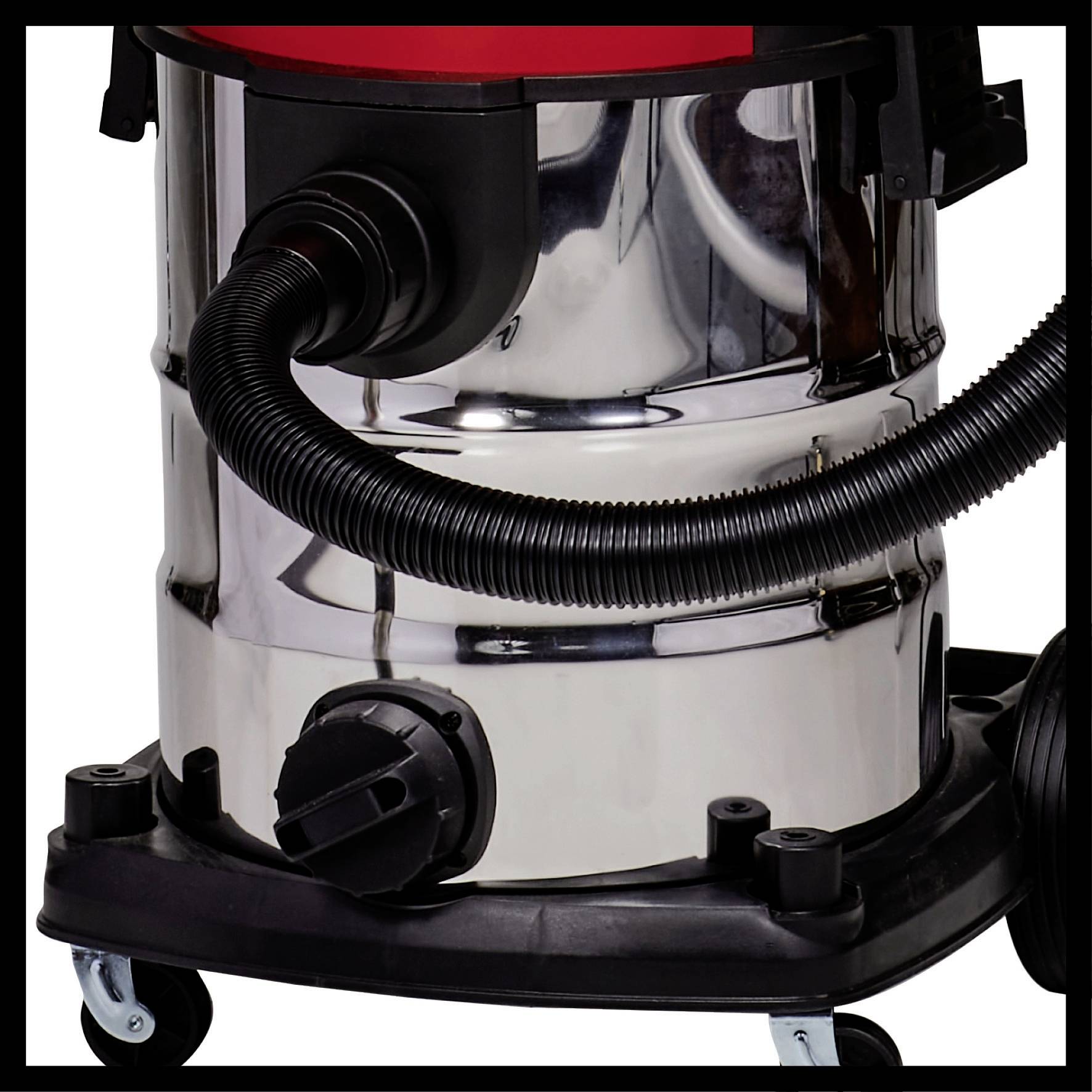 Silver industrial vacuum cleaner with black hose on wheels, suitable for removing large quantities of dirt in workshops.