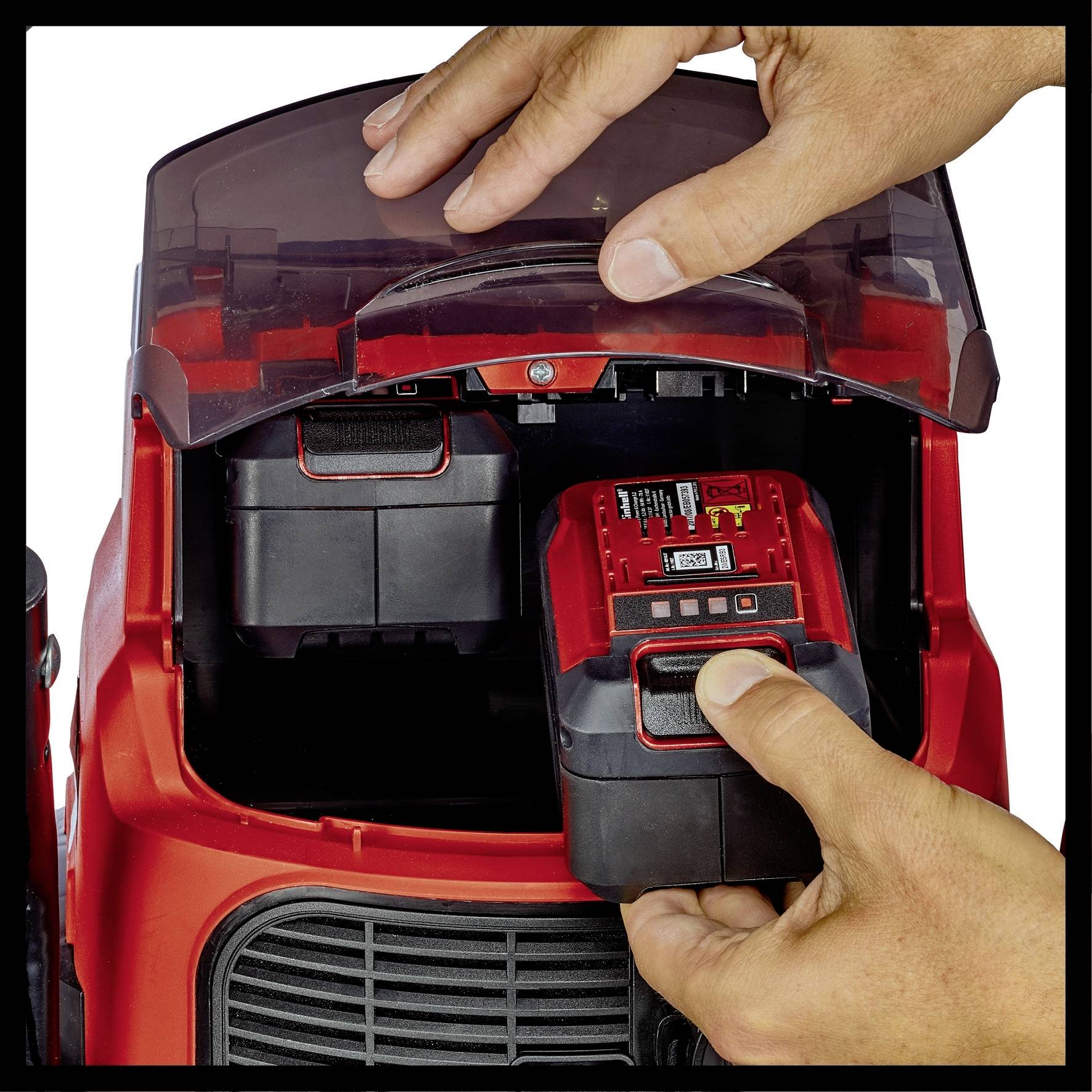 A close-up shows hands removing a battery from a red device. The device appears to be a cordless power tool.