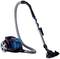 Vacuum cleaner with a transparent blue dust container and grey hose, mounted on wheels.
