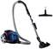 A vacuum cleaner with a removable nozzle and blue accents, suitable for floor cleaning in households.