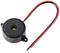 A small, round, black piezo buzzer with two connected cables, red and black, for electronic signalling.