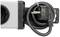 A black power plug with cable is plugged into a white multi-socket adaptor.