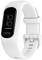 A white fitness band with a digital display showing '10:10'. The 'Garmin' brand name is visible on the display. Suitable for fitness tracking.