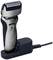 Electric shaver by Panasonic in charging station, silver-black, with wet/dry functionality.